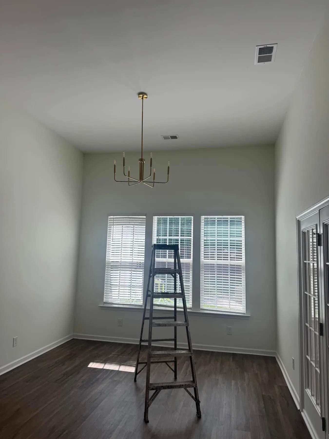 Bright interior room with light painted walls, ceiling and white trim